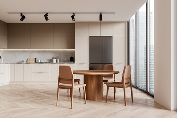 Beige kitchen interior with dining table