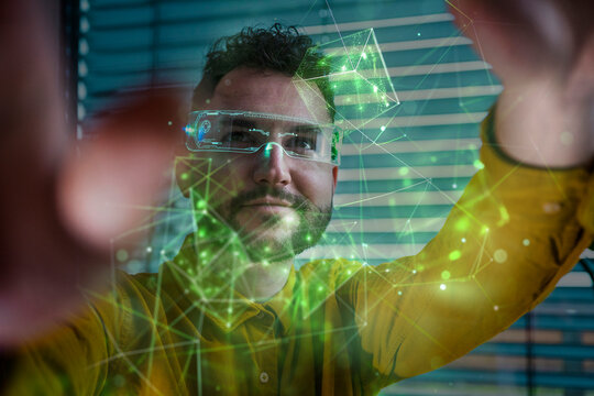 Smiling businessman wearing smart glasses and examining blockchain data