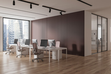 Modern office workspace interior with pc computers and panoramic window