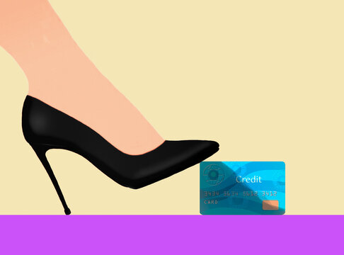 Woman's foot wearing black high heel and stepping on credit card