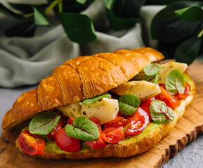 Gourmet tomato and mozzarella croissant sandwich