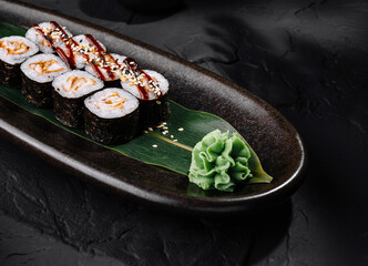 Gourmet sushi platter on elegant dark background