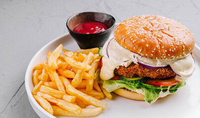 Classic cheeseburger with fries and ketchup