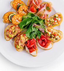 Gourmet bruschetta platter on white background