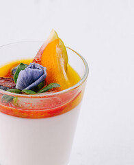 Gourmet panna cotta with fruit garnish