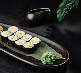 Elegant sushi platter on dark stone background