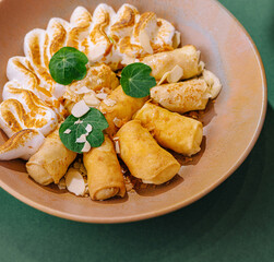 Gourmet stuffed pancakes on artistic plate