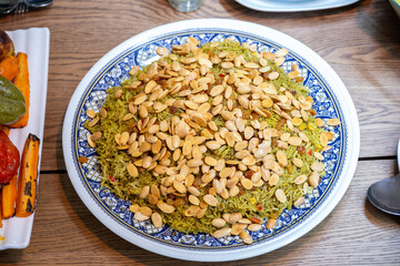 Rice plate on dinner table from top view for kabsa and sambousek  related to KSA uAE Qatar and jordan foods