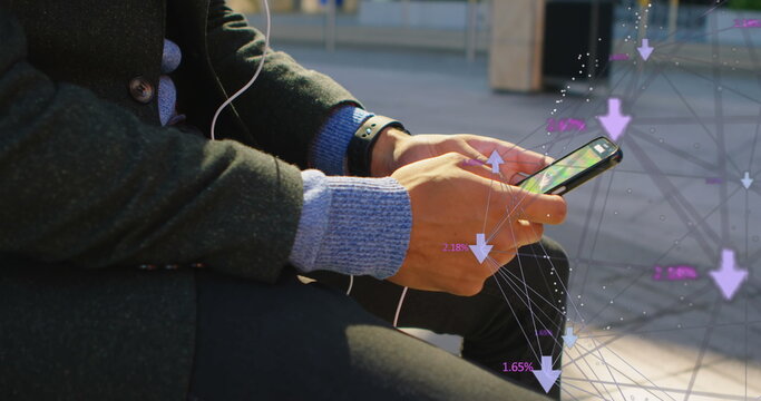 Biracial young professional holding smartphone, showing digital interface