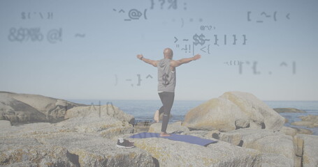 Image of data processing over senior african american man practicing yoga at beach - Powered by Adobe