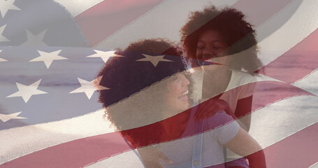 Image of flag of united states of america over happy african american mother with daughter