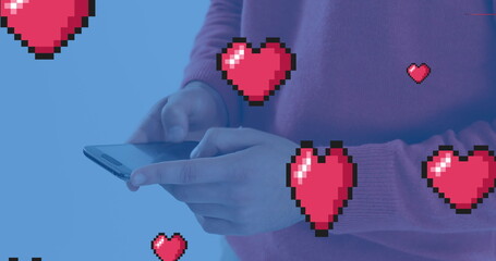 Caucasian young adult holding smartphone, hearts floating around