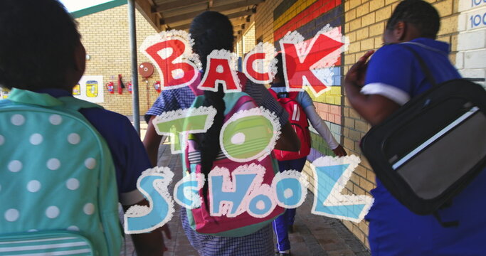 Image of back to school text over diverse schoolchildren