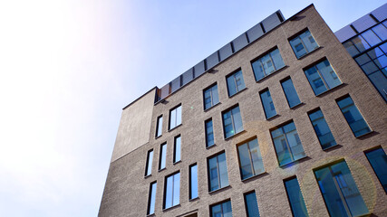 Modern office building detail. Perspective view of geometric angular concrete windows on the facade...