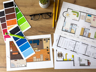 House plans, documents, technical drawings, blueprint drafts and color palettes at workplace