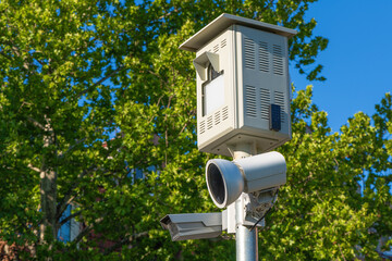 Traffic speed camera on post on sunny spring day