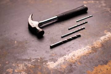 Extreme closeup of a metal hammer and drilling pins