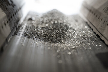 conveyor belt - aluminum particles - detail of an important raw material