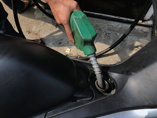 Close up refuel the motorbike. retail petrol filling on motorbikes