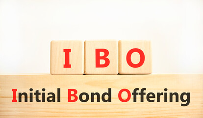 IBO initial bond offering symbol. Concept words IBO initial bond offering on beautiful wooden blocks. Beautiful white background. Business IBO initial bond offering concept. Copy space.