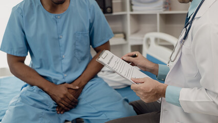A young man consults his doctor about the idea of ​​an enlarged prostate.
At the doctor's...