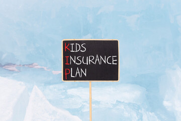KIP kids insurance plan symbol. Concept words KIP kids insurance plan on beautiful yellow...