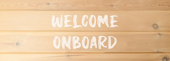 Welcome onboard symbol. Concept words Welcome onboard on beautiful wooden wall. Beautiful wooden...