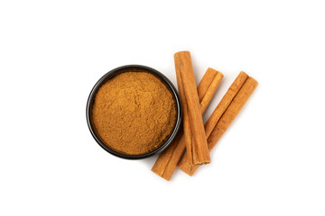 Cinnamon powder  isolated on white background. Spicy spice for baking, desserts and drinks. Fragrant ground cinnamon.