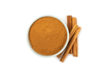 Cinnamon powder  isolated on white background. Spicy spice for baking, desserts and drinks. Fragrant ground cinnamon.