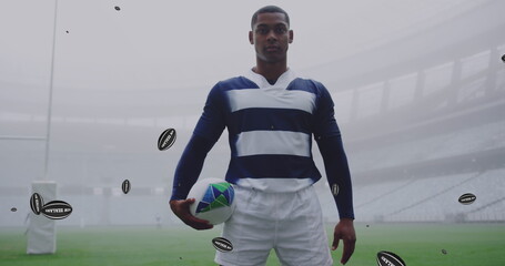 Image of african american male rugby player with rugby balls with new zealand texts over stadium