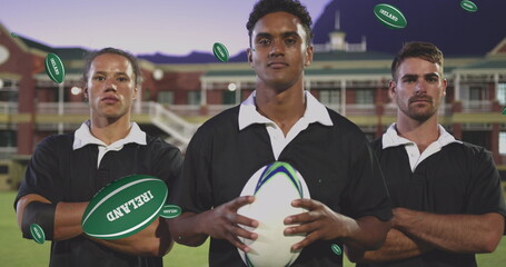 Image of diverse male rugby players with rugby balls with ireland texts over stadium