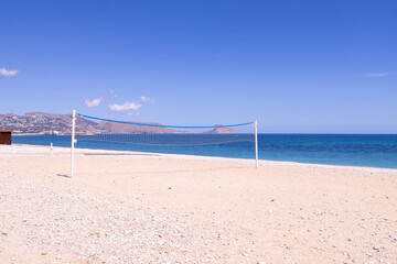 Photo of the beautiful beach in Albir, Altea, Alicante in Spain showing a volleyball net on the...