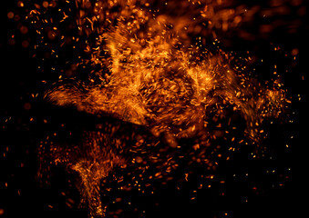 fire flame with sparks on black background.