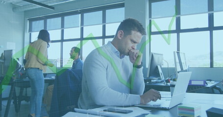 Image of green line and data processing over businessman