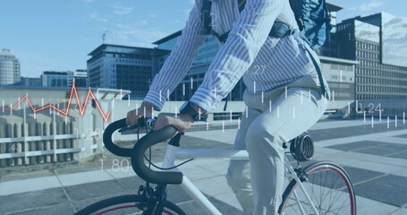 Image of financial data processing over biracial businessman on bike - Powered by Adobe