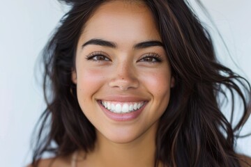Portrait of a beautiful woman with a warm smile, perfect for lifestyle and beauty concepts