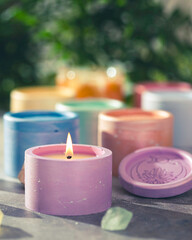 Candles in plaster candlesticks, colors of the 7 chakras, alternative medicine. Energy healing. Aromatherapy. Alternative medicine. Selective focus