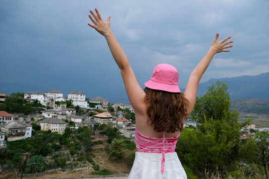 Gjirokastra attractions of Albania Thunder Sky Traveling to Albania watching the sights surprised young woman delighted with what is happening around