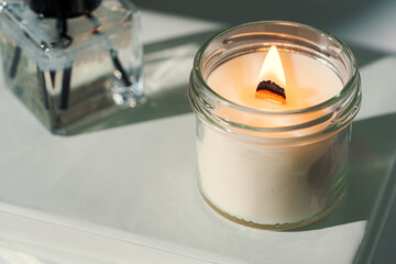 Aromatic candle in glass jar close up