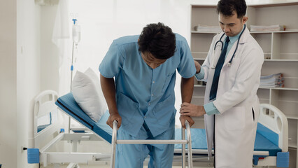 Professional physical therapist examines and cares for a young man in a physical therapy center, treating muscles and injuries of a man in a hospital.