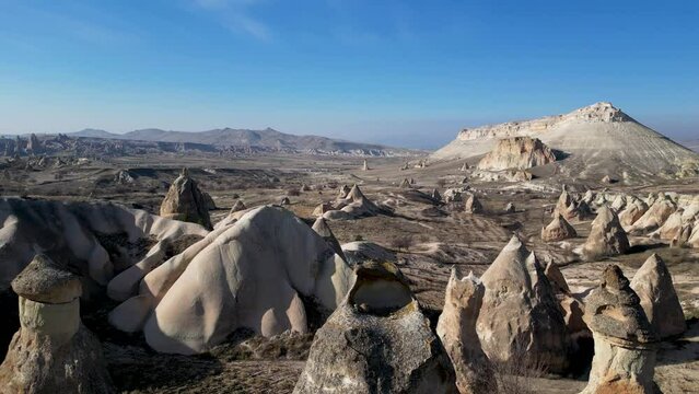 Aerial drone view of the natural beauty of the Fairy Chimneys in Cappadocia, Turkey. Famous destination for hikers to explore the Rock Sites.