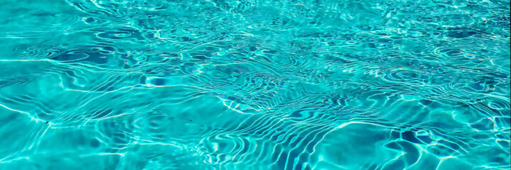 Crystal clear turquoise swimming pool water texture, ideal for summer and vacation themes, with a tranquil, refreshing vibe