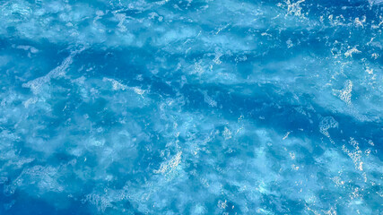 Crystal clear turquoise swimming pool water texture, ideal for summer and vacation themes, with a tranquil, refreshing vibe