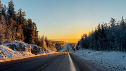 Winter road on sunrise