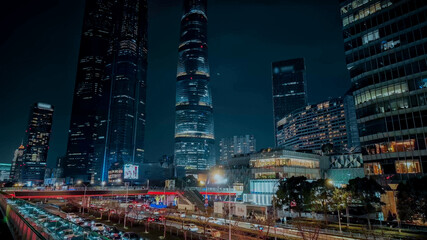 Stunning nocturnal cityscape with illuminated skyscrapers, busy traffic, and vibrant urban life,...
