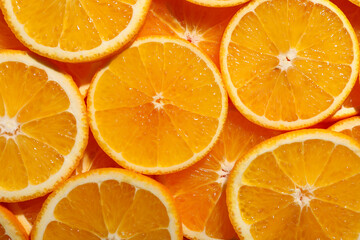 Slices of juicy orange as background, top view