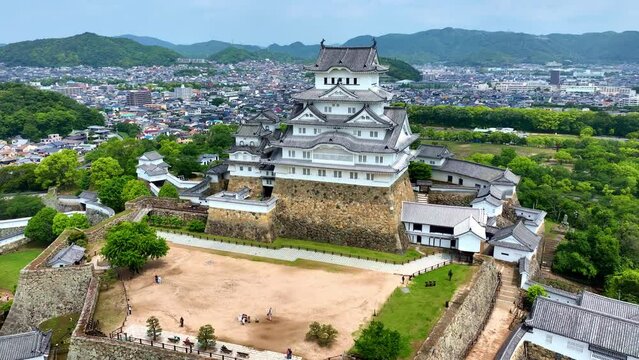 Aerial view of Himeji castle in Japan, traditional Japanese samurai fort in Hyogo prefecture, travel in Japan, medieval castle of Himeji drone view
