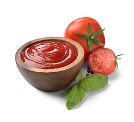 Tasty ketchup in wooden bowl, fresh tomatoes, peppercorns and basil isolated on white