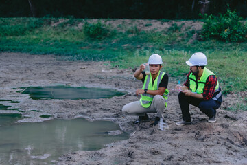 Environmental engineers work at wastewater treatment plants,Water supply engineering working at Water recycling plant for reuse,Technicians and engineers discuss work together