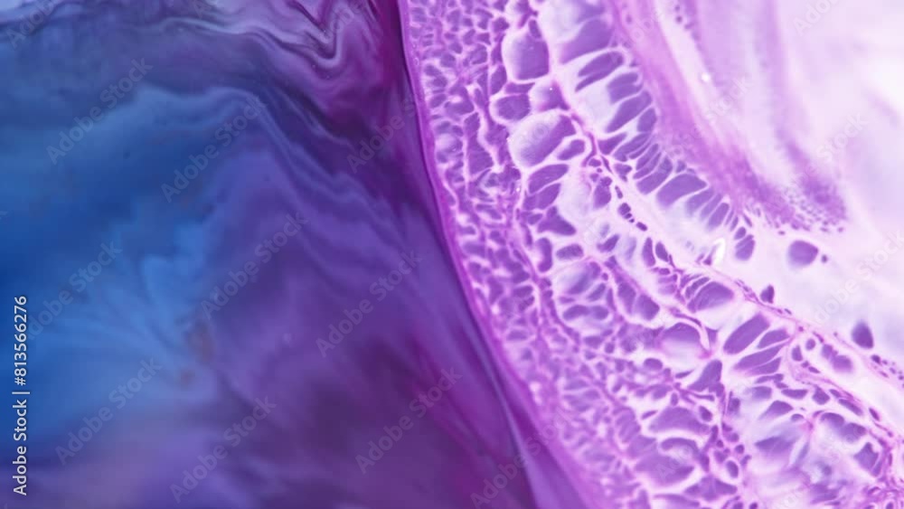 Poster vivid purple and blue ink swirling dynamically in water, creating abstract patterns